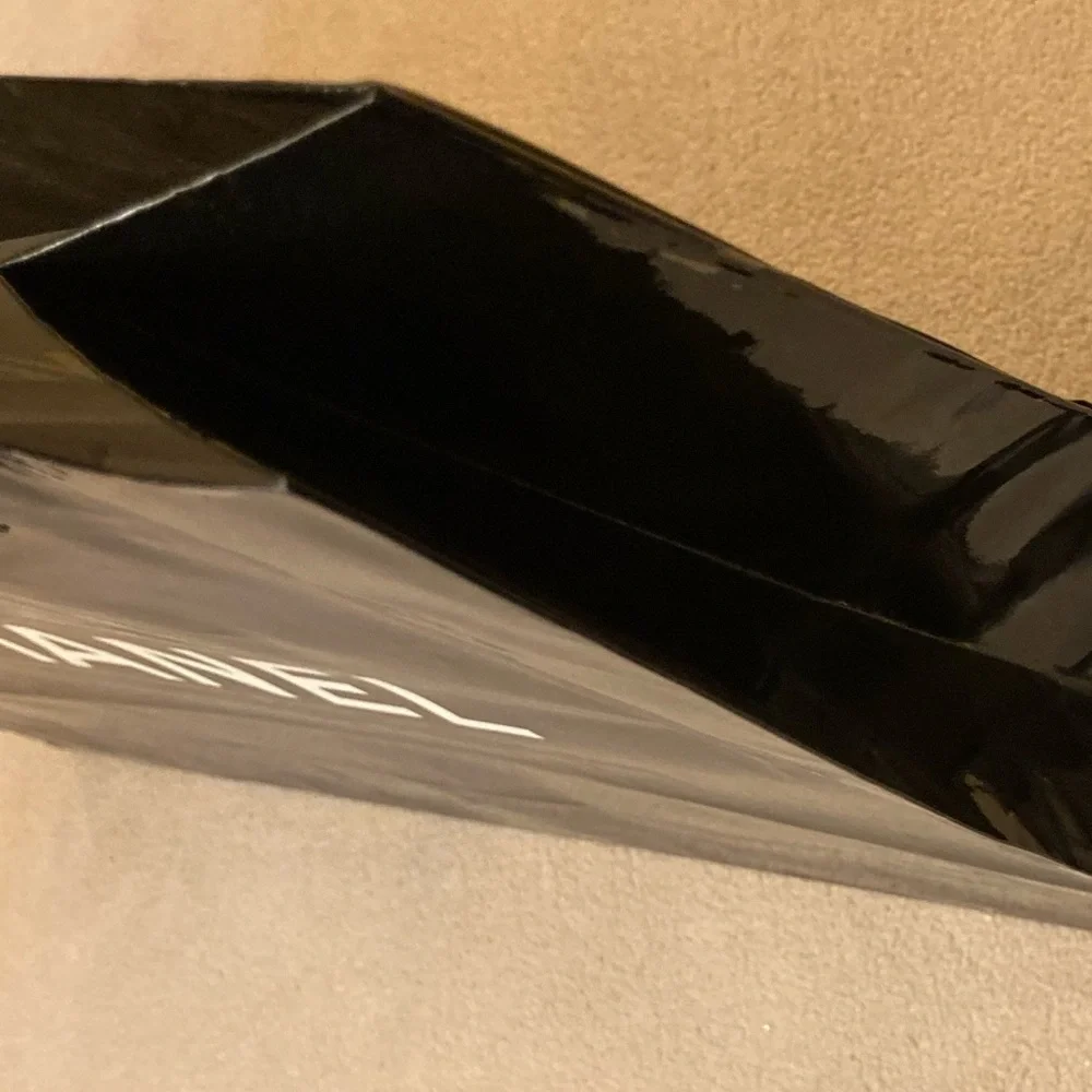 Chanel, high gloss glazed paper bag in black with White Chanel block letters